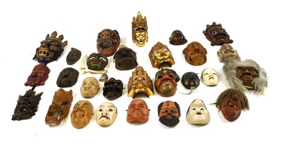 Lot 1417 - A large collection of predominantly Asian masks