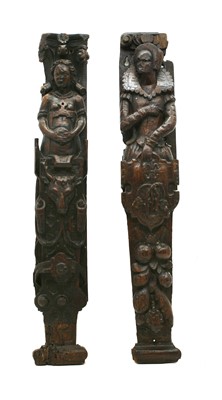Lot 1414A - Two carved oak figural pilasters