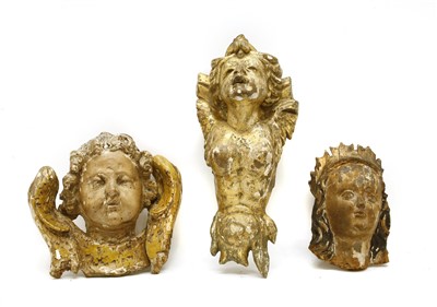 Lot 1375 - Three giltwood and painted carvings