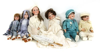 Lot 1272 - A collection of bisque headed dolls