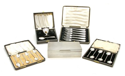 Lot 1148A - Two cased sets of six silver coffee spoons