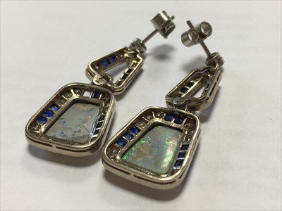Lot 41 - A pair of white gold opal, diamond and sapphire drop earrings