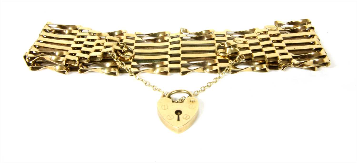 Lot 9 - A 9ct gold seven row gate bracelet