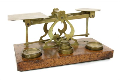 Lot 125 - A large set of Sampson Mordan and Co brass postal scales and weights