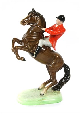 Lot 133 - A Beswick model of a rider on horseback