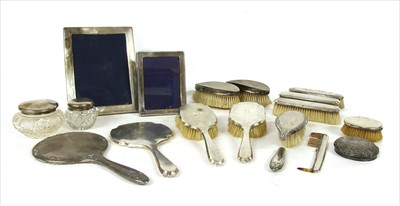 Lot 62 - A box of silver backed dressing table brushes and mirrors