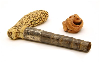 Lot 46 - A Japanese carved ivory walking stick handle