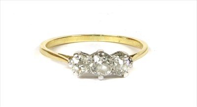 Lot 42 - A gold diamond three stone ring