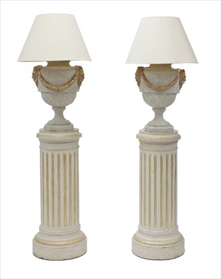 Lot 758 - A pair of painted and parcel gilt columns of classical design