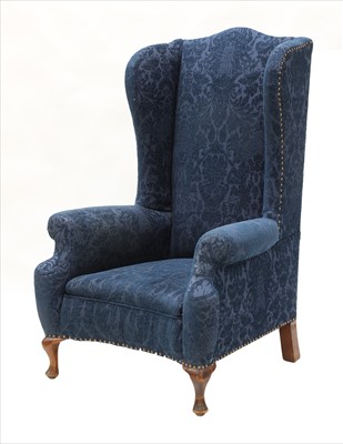 Lot 541 - A large wing back armchair