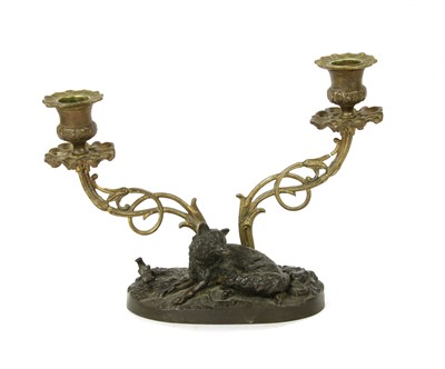 Lot 109 - A Mene bronze gilt metal candlestick with seated fox