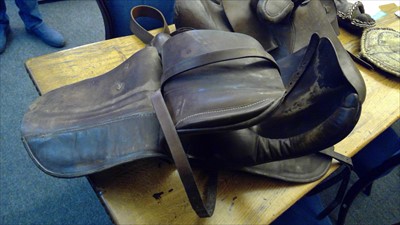 Lot 115 - A leather side saddle, and another