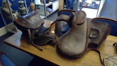 Lot 115 - A leather side saddle, and another