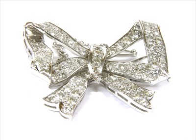 Lot 330 - A diamond set bow brooch