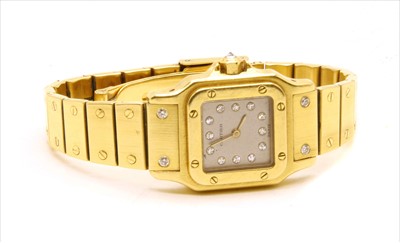 Lot 332 - A ladies' 18ct gold Cartier Santos automatic bracelet watch