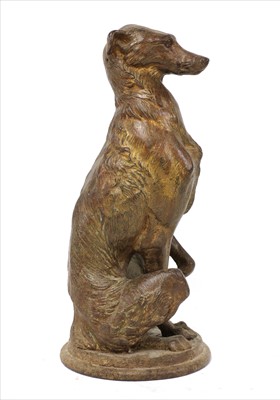 Lot 112 - A cast iron figure of a seated whippet