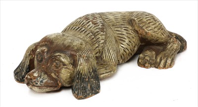 Lot 111 - A carved and polychrome painted figure of a spaniel