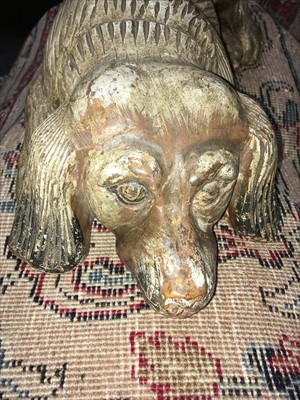 Lot 111 - A carved and polychrome painted figure of a spaniel