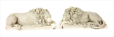 Lot 148 - A pair of modern composition figures of lions