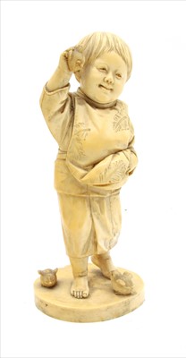 Lot 91 - A Japanese 19th century carved ivory figure of a young boy holding a young chick aloft