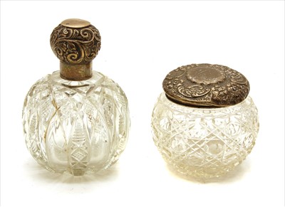 Lot 70 - An Edwardian cut glass and silver topped scent bottle