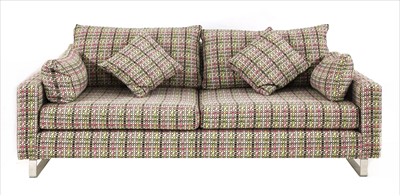 Lot 525 - A contemporary upholstered three-seater settee