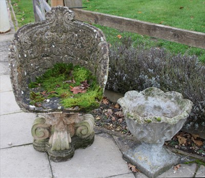 Lot 787 - A reconstituted stone garden chair in the rococo style