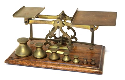 Lot 1106 - A large set of brass postal scales