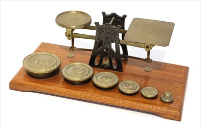 Lot 1110 - A set of brass and iron postal scales