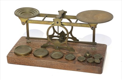 Lot 1116 - A large set of brass postal scales
