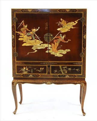 Lot 505 - A Japanese lacquered cocktail cabinet on stand