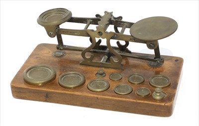 Lot 1119 - A set of brass postal scales