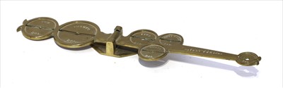 Lot 1157 - A brass counterfeit coin detector