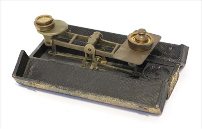 Lot 1169 - A cased brass traveller's letter scale