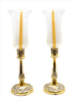 Lot 175 - A pair of silver plated candlesticks