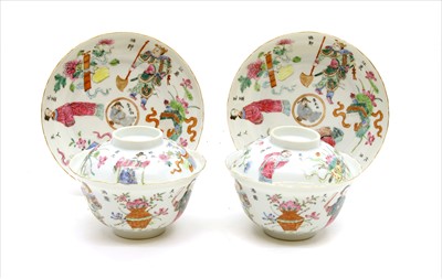 Lot 500 - A pair of Chinese famille rose rice bowls, covers and saucers