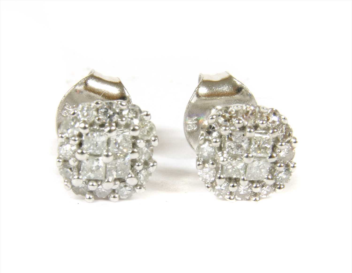 Lot 82 - A pair of white gold diamond cluster stud earrings