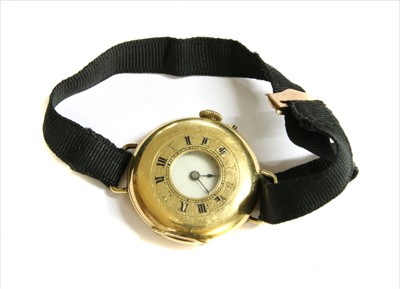 Lot 142 - An 18ct gold half hunter style pin set mechanical strap watch
