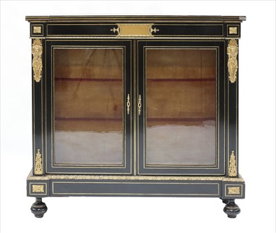 Lot 776 - A French ebonised and gilt metal-mounted pier cabinet