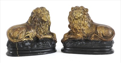 Lot 771 - A pair of moulded terracotta figures of lions