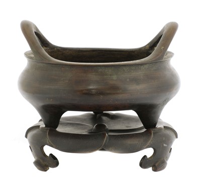 Lot 175 - A Chinese bronze incense burner and stand