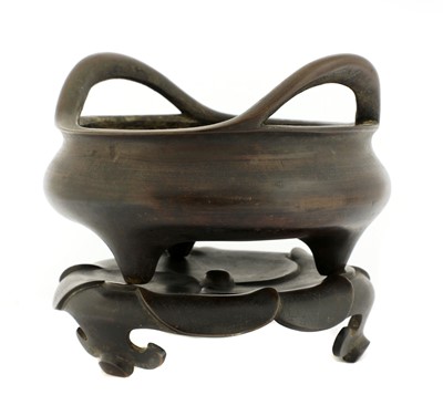 Lot 175 - A Chinese bronze incense burner and stand
