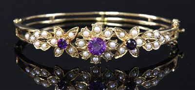 Lot 74 - A 9ct gold amethyst and split cultured pearl hinged bangle, c.1970