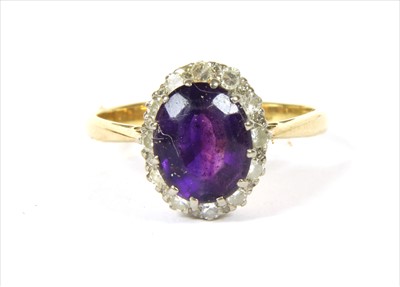 Lot 98 - A gold amethyst and diamond cluster ring