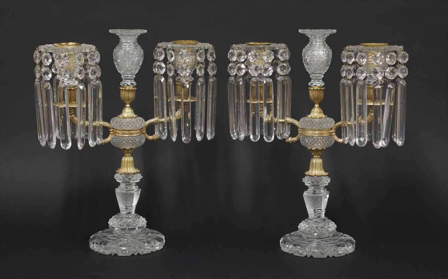 Lot 27 - A pair of cut-glass and gilt metal candelabra