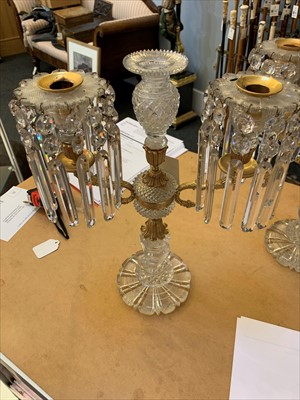Lot 27 - A pair of cut-glass and gilt metal candelabra
