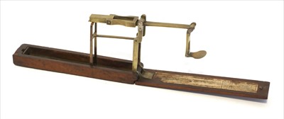 Lot 1059 - A mahogany cased brass folding coin scale