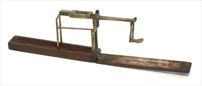Lot 1064 - A mahogany cased brass folding coin scale