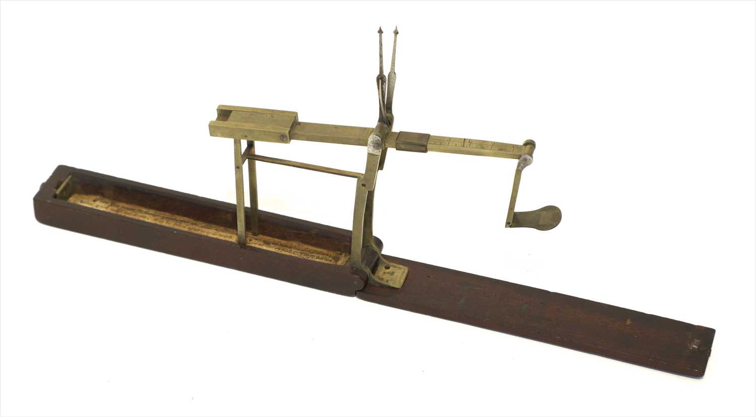 Lot 1072 - A mahogany cased brass folding coin scale