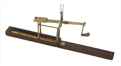 Lot 1072 - A mahogany cased brass folding coin scale